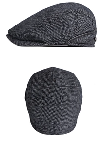 Dettaglio cappello newsboy grigio scuro spina di pesce con finiture in pelle