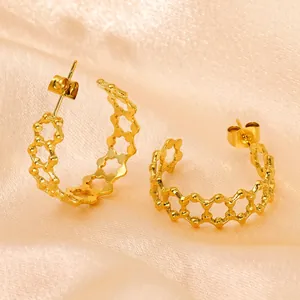 Minimalist 18K gold-plated stainless steel hollow hexagon hoop earrings on satin
