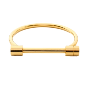 Polished gold stainless steel screw cuff bangle with minimalist industrial horse shoe design