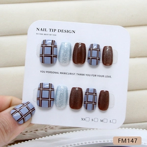 Handmade press-on nails featuring blue and brown plaid patterns with cat-eye glitter finish