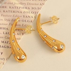 Irregular cone earrings in gold plated titanium steel with sparkling white cubic zirconia