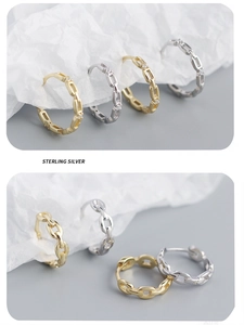 Detail showing S925 sterling silver chain earrings with gold and silver cubic zirconia