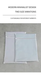 Close-up of thick mesh polyester laundry bags with gray zipper in two sizes