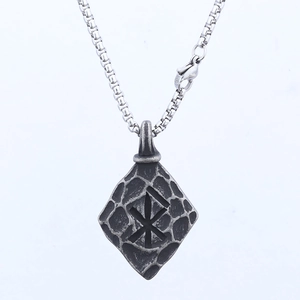 Vintage stainless steel necklace with antique silver Runic pendant on white background