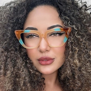 Front view of amber and blue cat-eye frames worn by a model to show stylish face fit