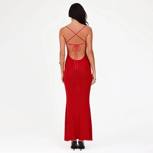Close-up of red bodycon dress featuring elegant backless design with cross straps and bow