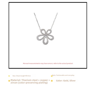 Macro detail of the five-petal flower pendant with glittering zircon and silver plating