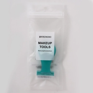 Detail view of a mint green lady hair removal razor in branded ZIKOKO makeup tool packaging