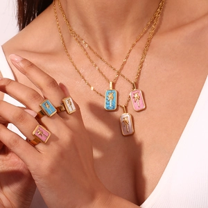 18K gold plated stainless steel jewelry set featuring palm tree pendants with colored shells