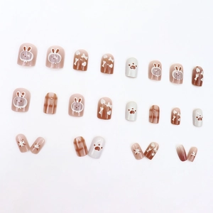Hand-painted press-on nails with cute rabbit, bone, and heart patterns in coffee tones
