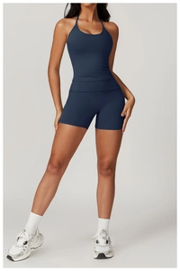 Detail view of navy blue halter yoga top and high-waisted quick-dry gym shorts set
