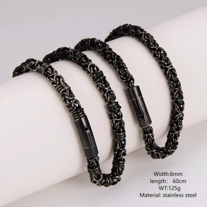 Black stainless steel 8mm curb chain necklace for men shown on a white cylindrical display