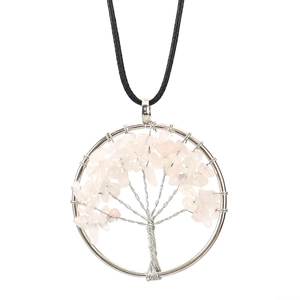 Detail of handmade wire wrapped tree of life pendant with pink natural crystal stones
