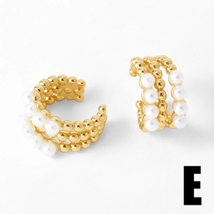 Detailed view of luxury gold C-shaped ear cuff featuring triple rows of white pearls