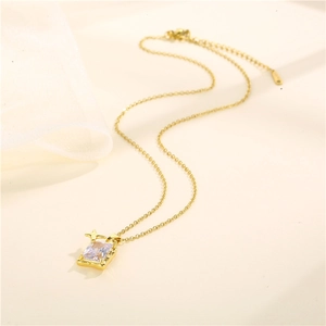 Golden stainless steel necklace featuring square zircon pendant with tiny star accent