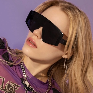 Detailed view of black oversized shield sunglasses for trendy outdoor streetwear and daily style