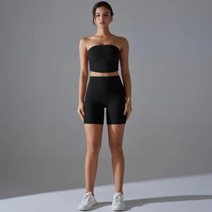 Front view of black ruched bandeau top and high-waist yoga shorts set for women