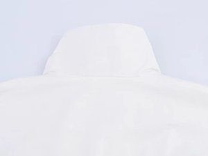 Close-up of the white high-neck jacket back view featuring a clean hooded structure
