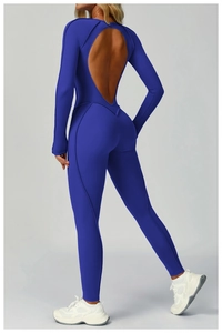 Detail of navy blue yoga jumpsuit featuring a large open-back cutout and seamless stitching