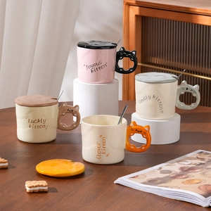 Set of four cute ceramic cat mugs with cat-shaped handles, lids and metal spoons