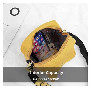 Internal view of a yellow canvas crossbody bag showing spacious capacity for daily items