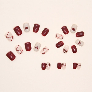 Retro wine red and cream press-on nails with heart patterns and diamond check design
