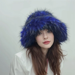 Close-up of thick faux fur winter bucket hat in royal blue and black color mix