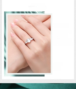 Close-up of 925 sterling silver three-stone ring with oval and pear-shaped zircons