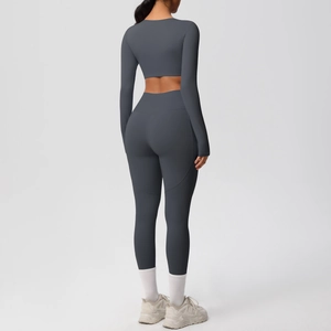Back view of dark grey high-stretch yoga set with long sleeve crop top and leggings