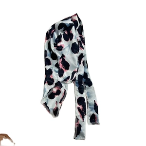 Macro detail of silky leopard print yoga durag featuring premium satin texture and long straps