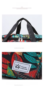 Detail view showing sturdy woven handles and smooth two-way zippers on floral travel bag