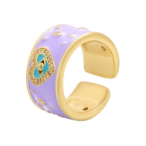 Detail of gold evil eye heart ring with purple enamel coating and micro-set crystals
