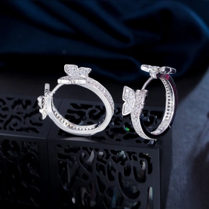 Sparkling silver butterfly hoop earrings with zirconia stones in a minimalist Korean style