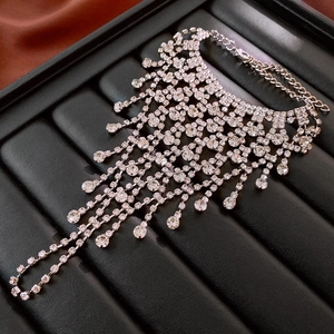 Detail of silver rhinestone layered tassel jewelry with mesh net and lobster clasp