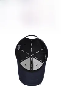 Detail of navy baseball cap interior with reinforced FBXS tape and adjustable metal buckle