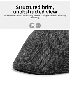 Detail of grey herringbone flat cap brim showing premium wool texture and sunshade function