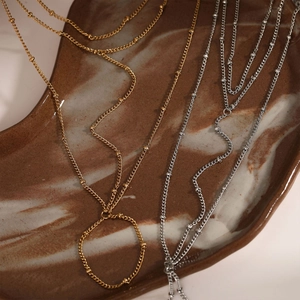 Minimalist stainless steel back hand chain with fine beads in gold and silver finish