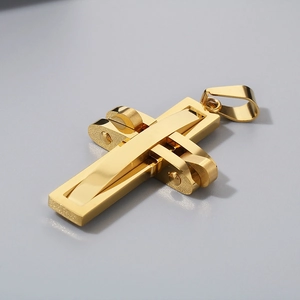 Detailed macro shot of a gold mechanical cross pendant with polished stainless steel finish