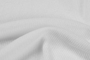 Macro shot of white ice silk knit fabric showing fine texture and breathable weave