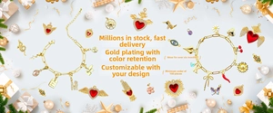 Close-up of assorted gold charms with zircon and leopard print heart on jewelry display
