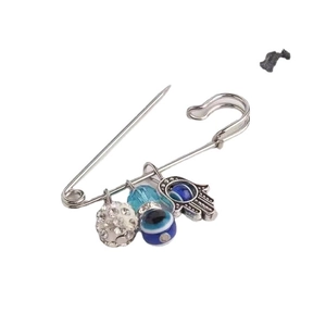 Silver Evil Eye brooch with rhinestone ball, Hamsa hand pendant, and blue eye charms