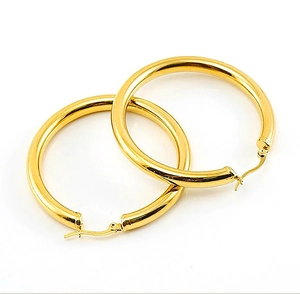 Close-up of hollow 18K gold plated titanium steel hoop earrings on white background