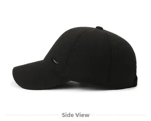Side view of winter men's wool baseball cap with ear flaps and small metal logo