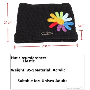 Size guide for black knitted cat ear beanie with daisy patch and decorative pin details