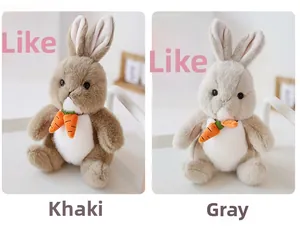 Close-up of khaki and grey plush rabbits holding carrots in a cozy home setting
