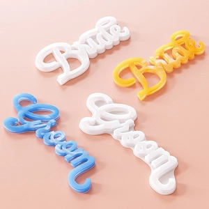 Detailed view of Groom and Bride letter molds with marble texture for wedding decor