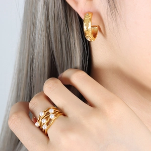 French palace style golden sun moon hoop earrings and pearl ring set on model