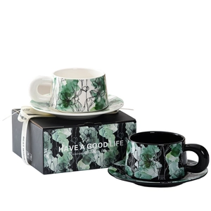Floral ceramic coffee cup and saucer set in elegant gift box with green and black patterns