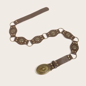 Close-up of vintage brown PU leather belt with decorative gold conchos and ornate buckle