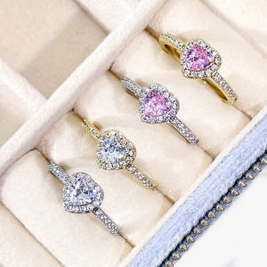 Elegant heart-shaped rings in gold and silver finish with sparkling gemstones